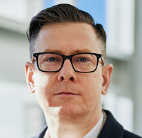 Alexander Hughes, dyrektor generalny i CEO firmy zajmującej się handlem kryptowalutami, portret